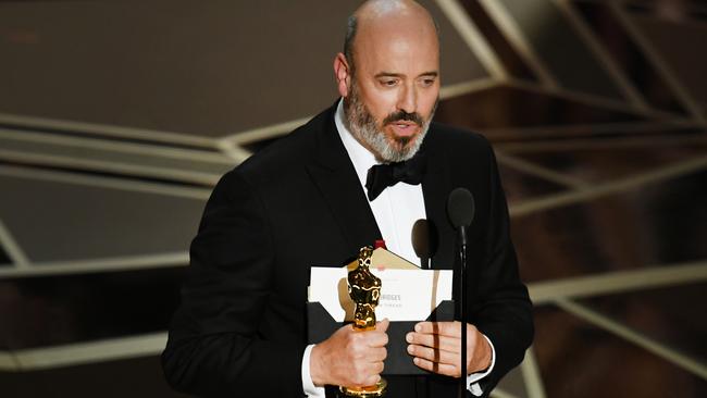 Costume designer Mark Bridges accepts Best Costume Design for Phantom Thread. Picture: Getty