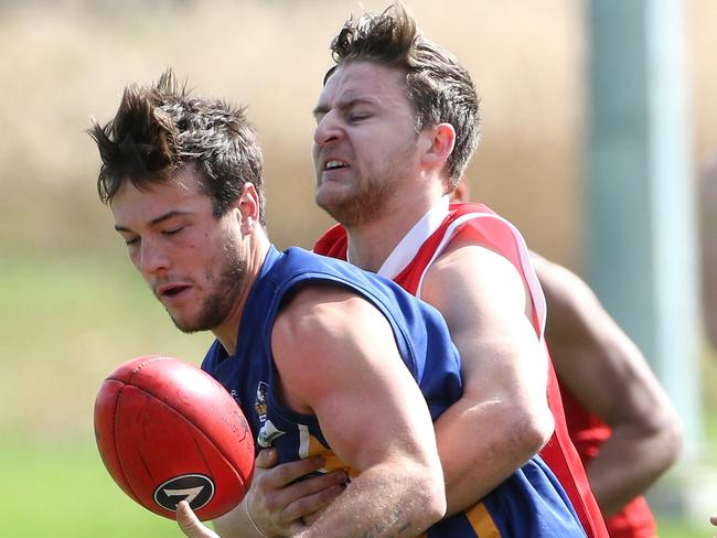 Luke Whelan tries to control the ball. Picture: Hamish Blair