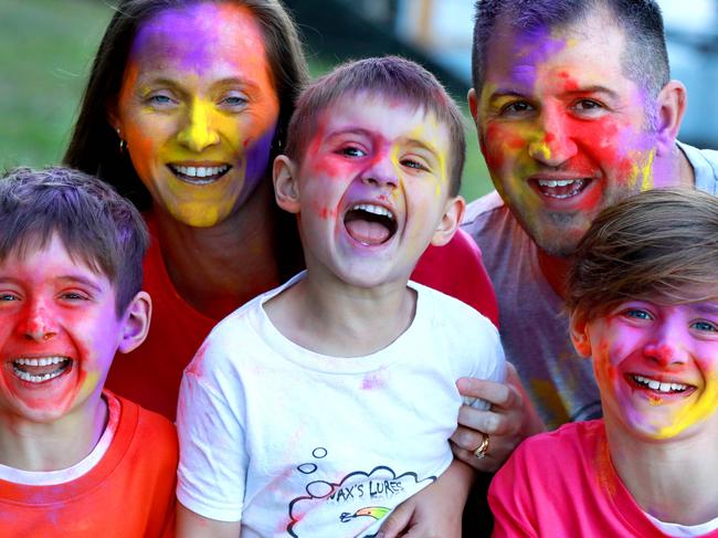 L-R Seth 7, Michelle, Chase 4, Phillip and Xander Rigoli 10 pose for photographs in Parramatta. Parramatta, Friday, September 21st 2018. The Colour Run Australia are bringing their new Hero Tour to Sydney Olympic Park  Parramatta family who are taking part. (AAP Image / Angelo Velardo)