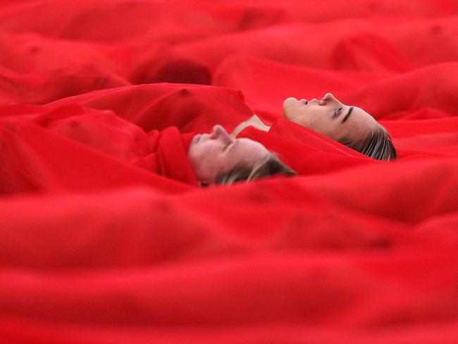 Two women pose for Spencer Tunick in Melbourne. Picture: Michael Dodge/Getty Images