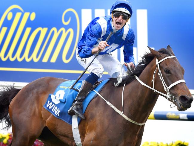 Hugh Bowman after Winx crosses the line by a record winning margin. Picture: Nicole Garmston