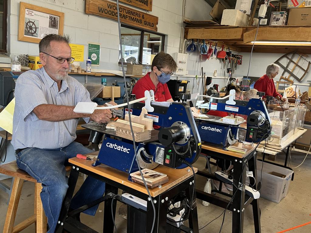 Woodworkers giving a display of their skills at the Fraser Coast Show.