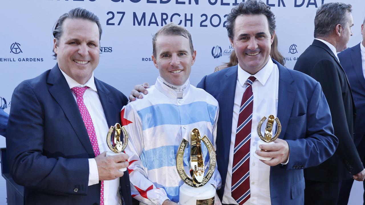 Jockey Tommy Berry (centre) celebrates his 2021 Golden Slipper victory aboard Stay Inside with trainers Richard (left) and Michael Freedman. Picture: Mark Evans / Getty Images