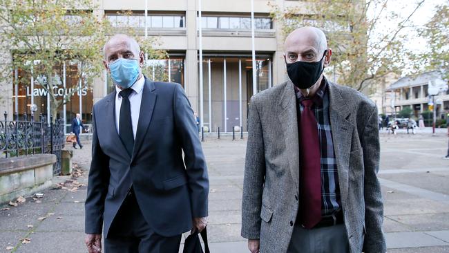 On trial for murdering his wife Lynette 40 years ago, Chris Dawson (left) and his twin brother leave court. Picture: Jane Dempster