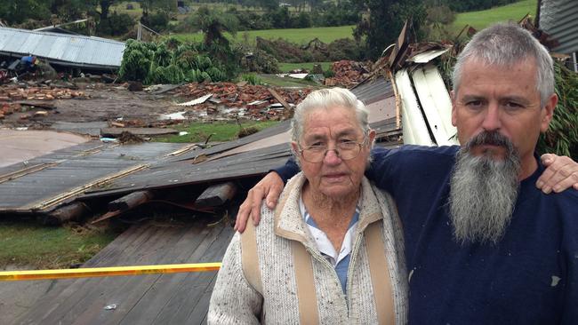 Heather Muddle and her family member Rick Andrews out the front of what was her home which was washed away in the floods. Picture: Samantha Townsend