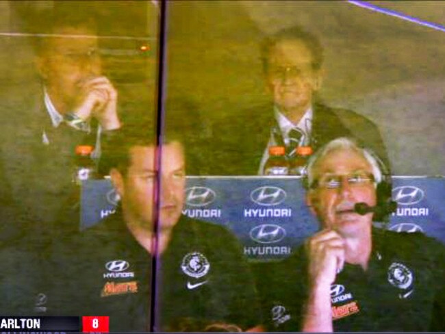 Geoffrey Edelsten in the Carlton coaches box with Mick Malthouse in 2015.