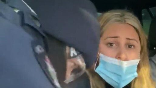 Natalie Bonett being dragged from her car by police at a checkpoint at Wallan. Picture: Facebook