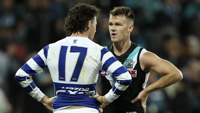 Jasper Pittard chats with former teammate Robbie Gray after the game. Picture: Sarah Reed.