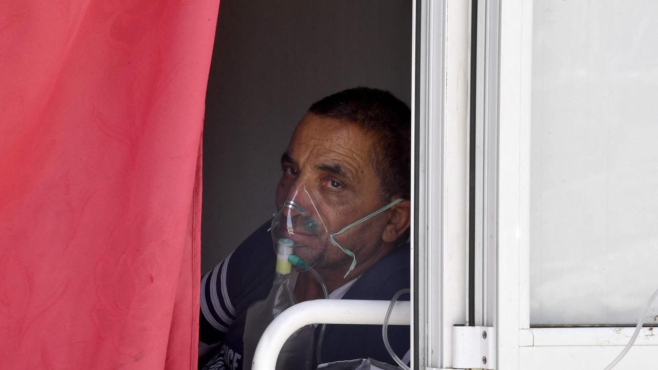 A man infected by the Covid-19 coronavirus receives oxygen as a first aid at a hospital in the northwestern town of Beja. Picture: AFP