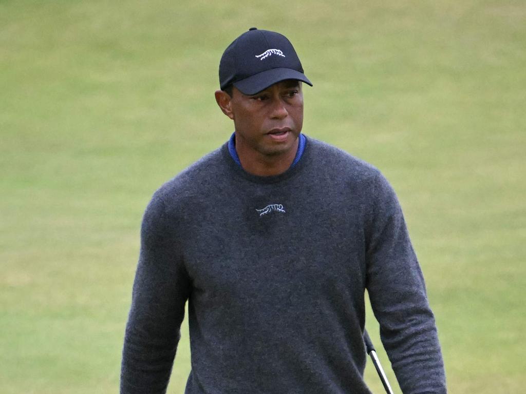 US golfer Tiger Woods walks onto the 14th green on the opening day of the 152nd British Open Golf Championship at Royal Troon on the south west coast of Scotland on July 18, 2024. (Photo by ANDY BUCHANAN / AFP) / RESTRICTED TO EDITORIAL USE