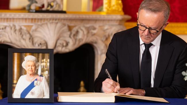 Prime Minister Anthony Albanese signs a book of condolence at Lancaster House. Picture: Getty Images