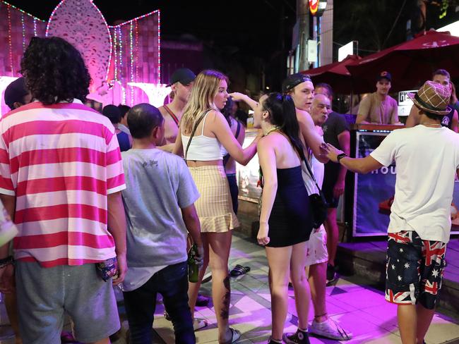 Young Australians fighting in Kuta’s nightclub district with the Ground Zero bombing memorial in the background. Picture: Liam Kidston