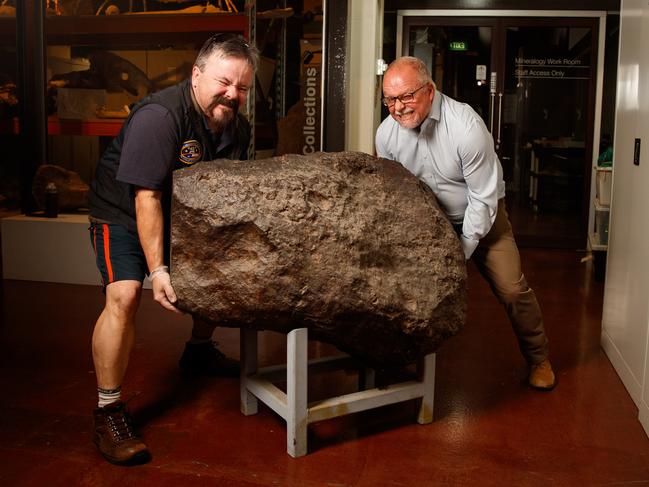 26/3/2020 Paul Curnow from the Adelaide Planetarium with SA Museum earth sciences senior collections manager Ben McHenry with the Huckitta meteorite (4.5 billion years old), which is being transported  to the Planetarium at Mawson Lakes on Thursday, for them to put on public display.