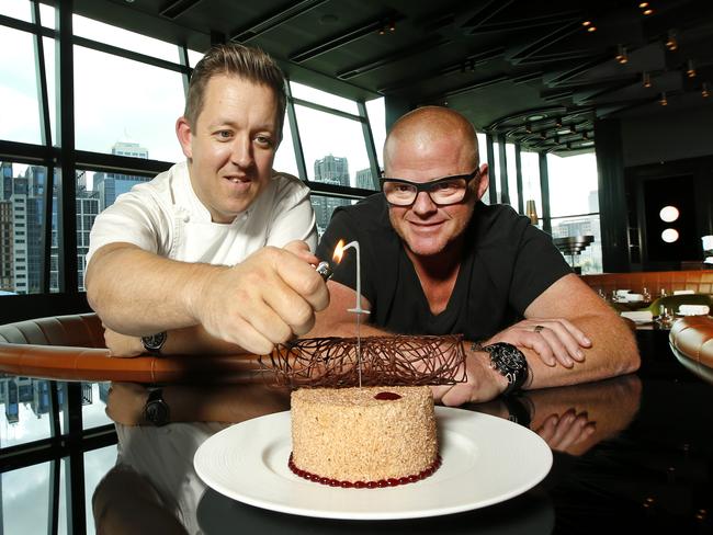 Chefs Ashley Palmer Watts and Heston Blumenthal light the sparkler on the birthday cake to celebrate the first anniversary of the restaurant at Crown. Picture: David Caird