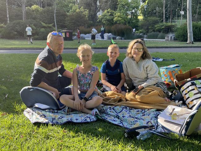 Kim, Martin and the kids at Treasury Gardens in the Melbourne CBD for the 2024 New Year's Eve fireworks. Picture: Gemma Scerri