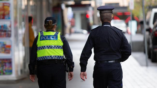 Police walking Hindley St and North Terrace. Picture: Brett Hartwig