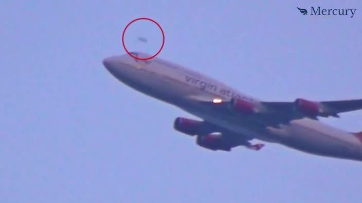 Unidentified Flying Object seen roaring past a Virgin Airlines jet