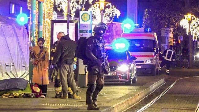 A special forces officer stands guard where up to 60 people have been injured at a Christmas market in Magdeburg, eastern Germany. Picture: Erik-Holm Langhof / NEWS5 / AFP