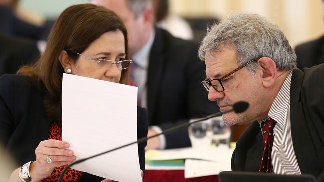 Queensland Premier Annastacia Palaszczuk speaks with Chief of staff David Barbagallo during estimate hearings at Queensland Parliament in Brisbane, Tuesday, July 23, 2019. (AAP Image/Jono Searle) NO ARCHIVING