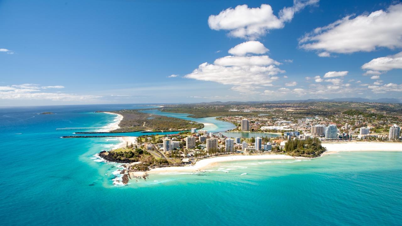 An aerial view of Greenmount Beach and Snapper Rocks at Coolanagatta on Queensland's Gold Coast in Australia on a clear blue water day. 2 July 2023 48hrs - Coolangatta Photo - iStock