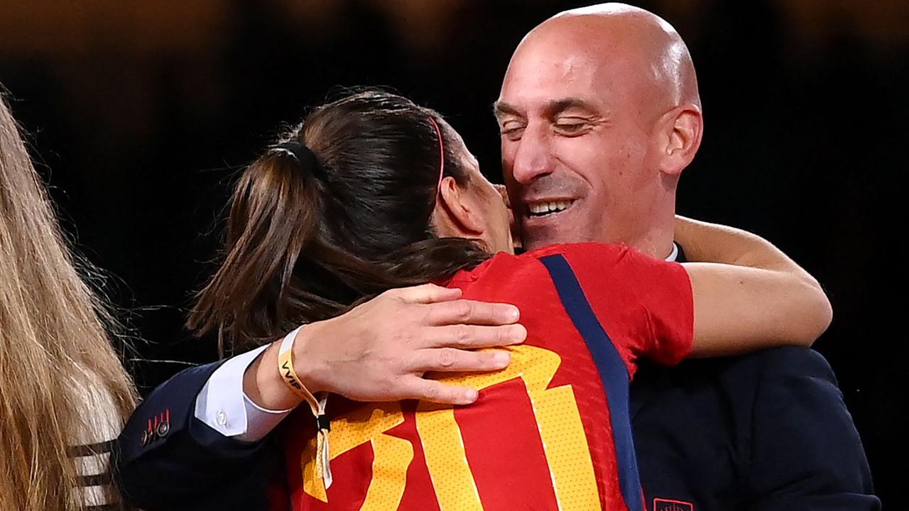 Spain's defender #20 Rocio Galvez is congratuled by President of the Royal Spanish Football Federation Luis Rubiales (R) next to Spain's Jennifer Hermoso #10 after winning the Australia and New Zealand 2023 Women's World Cup final football match between Spain and England at Stadium Australia in Sydney on August 20, 2023. (Photo by FRANCK FIFE / AFP)