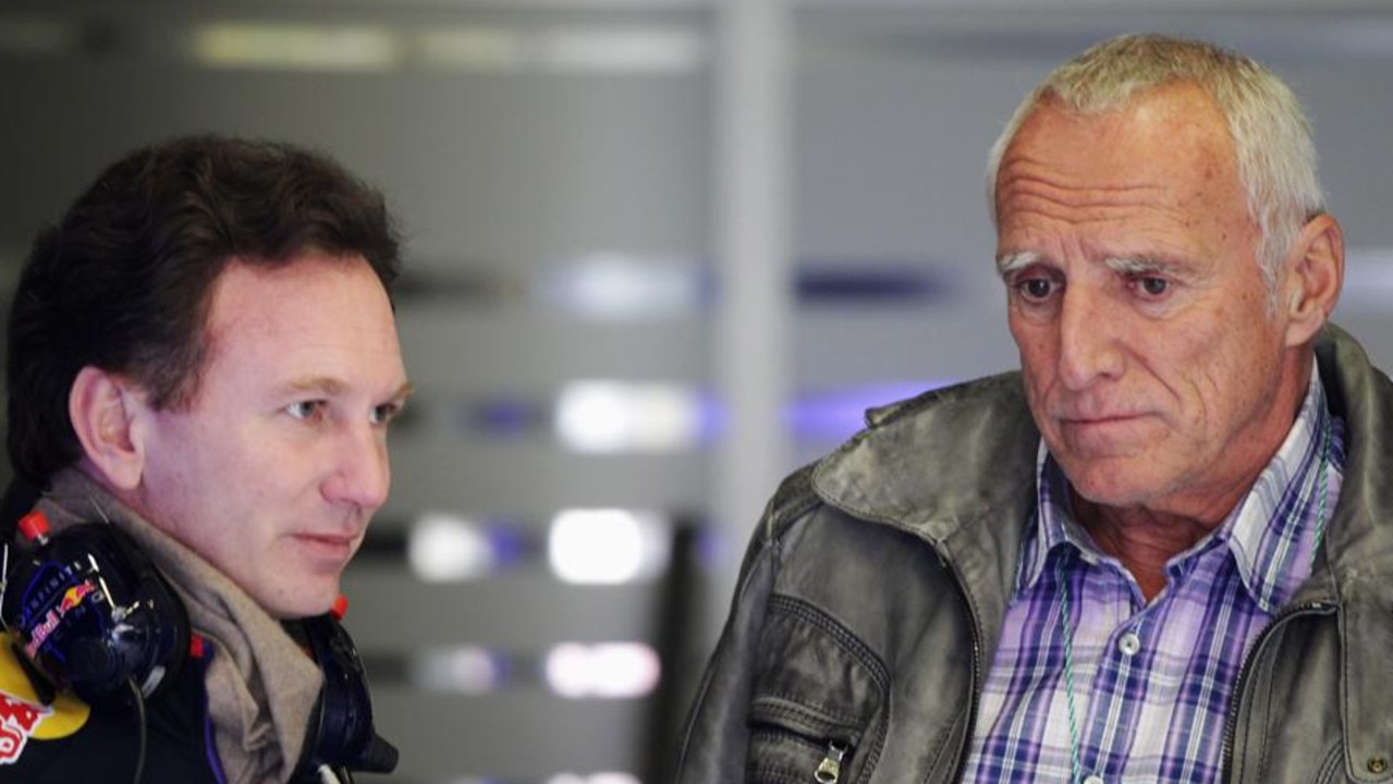 Red Bull owner Dietrich Mateschitz (R) talks with Team Principal Christian Horner in 2014. (Photo by Ker Robertson/Getty Images)