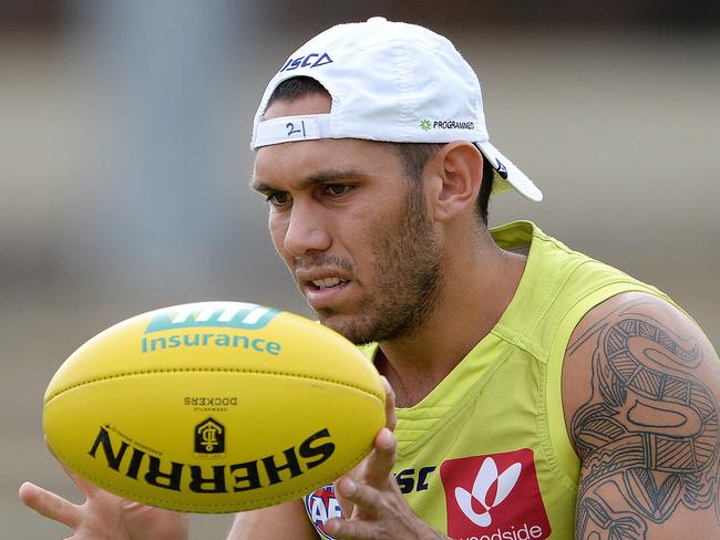 SPORT - The Fremantle Dockers train ahead of their season opener on Sunday. Photo by Daniel Wilkins. PICTURED- Harley Bennell does some handball drills during training