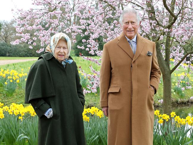 Queen Elizabeth and Prince Charles posed for an Easter portrait in the garden. Picture: Getty Images