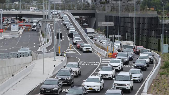 A traffic jam at the Rozelle Interchange as students return from holidays. Cars queued on the western merge where traffic enters from The Crescent. Picture: Max Mason-Hubers