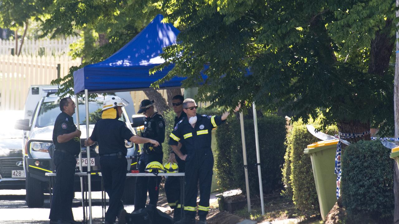 Police and fire investigators at a South Toowoomba crime scene followingthe alleged murder of Mr Weaver. Picture: Kevin Farmer