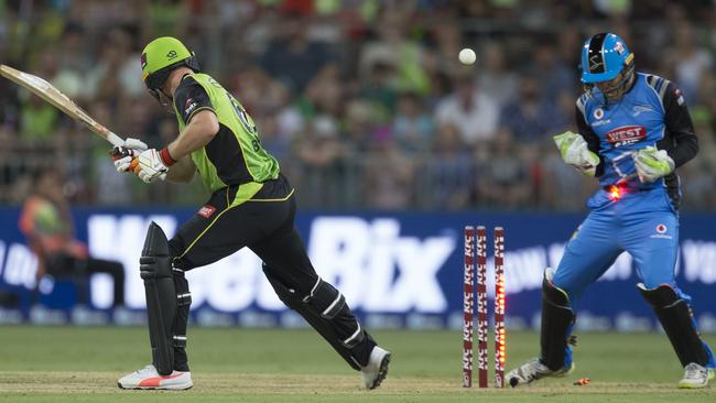 Jos Butler is bowled by Rashid Khan of the Strikers. Picture: AAP / Craig Golding