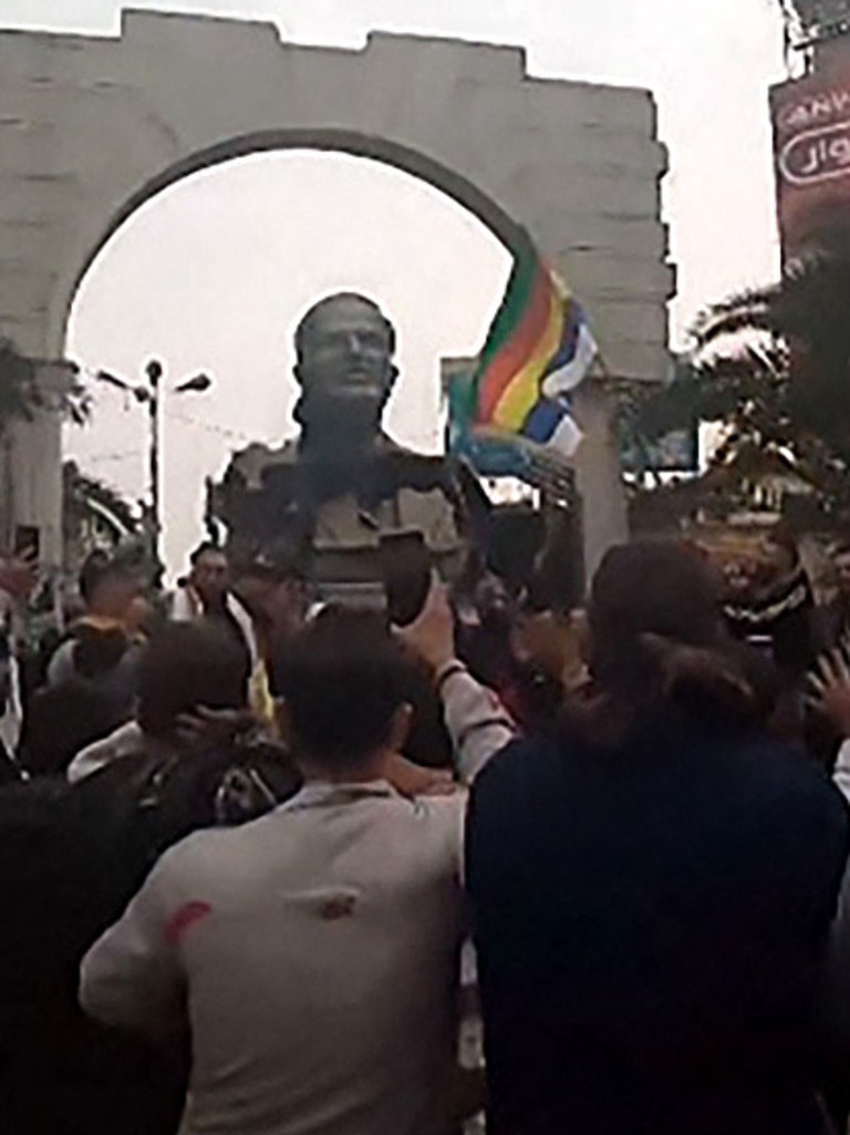 This image grab from a UGC video posted on December 7, 2024 shows Syrian protesters toppling a statue of late president Hafez al-Assad in Jaramana. Picture: UGC/AFP