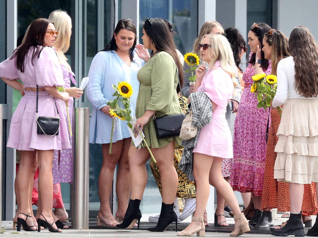 Friends of Ms Cowley wore bright coloured clothes and carried sunflowers. Picture: NCA NewsWire/ Richard Gosling