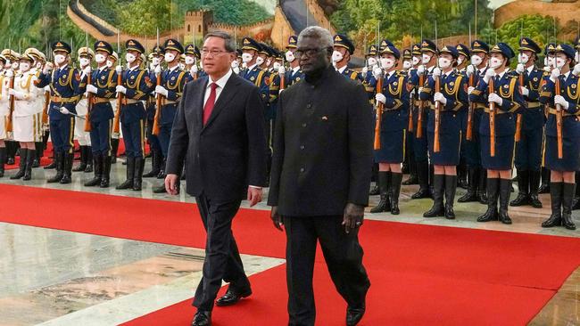 Manasseh Sogavare and China's Premier Li Qiang during a welcome ceremony at the Great Hall of the People in Beijing in July 2023. Picture: POOL / AFP