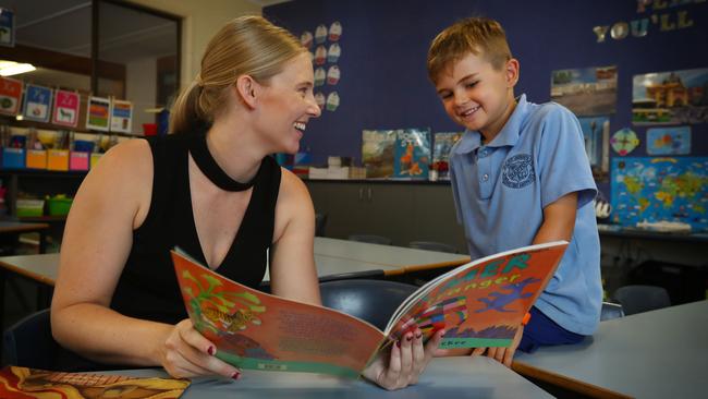 Teacher Jessica Purdy reads with Preston Tanevski, a Year 1 student at St John's Catholic Primary School in Dapto, NSW, where the Reading Recovery program is used. Picture: John Feder