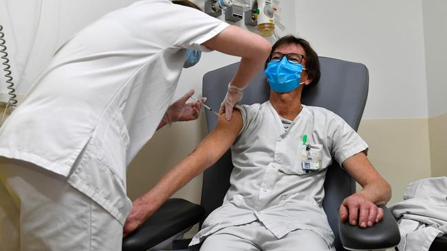 A medical staff receives a dose of the Pfizer-BioNTech COVID-19 vaccine on January 8, 2021 at the Cavale Blanche hospital in Brest, western France. Picture: AFP.