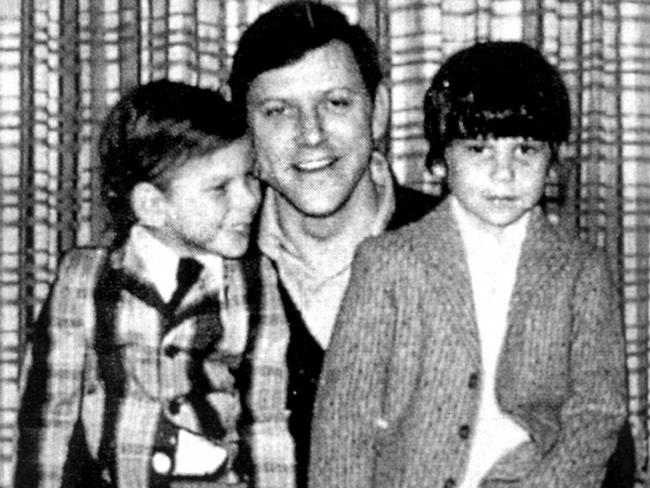 An undated photo of Erik and Lyle Menendez sitting on the knees of their father Jose.