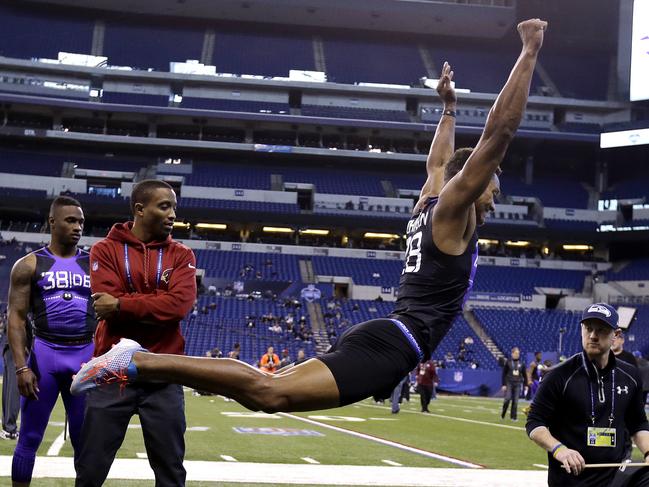 Connecticut defensive back Byron Jones runs a drill at the NFL football scouting combine in Indianapolis, Monday, Feb. 23, 2015. (AP Photo/Julio Cortez)
