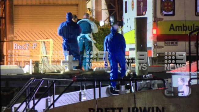 Water police transported two COVID-19 positive patients from a cargo ship to Townsville where they will be treated. Photo: 9 News North Queensland