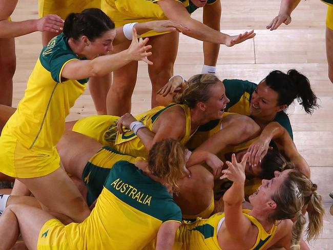 GLASGOW, SCOTLAND - AUGUST 03: The Australian team celebrate victory in the gold medal netball match between Australia and New Zealand at the SECC Precinct during day eleven of the Glasgow 2014 Commonwealth Games on August 3, 2014 in Glasgow, United Kingdom. (Photo by Mark Kolbe/Getty Images)
