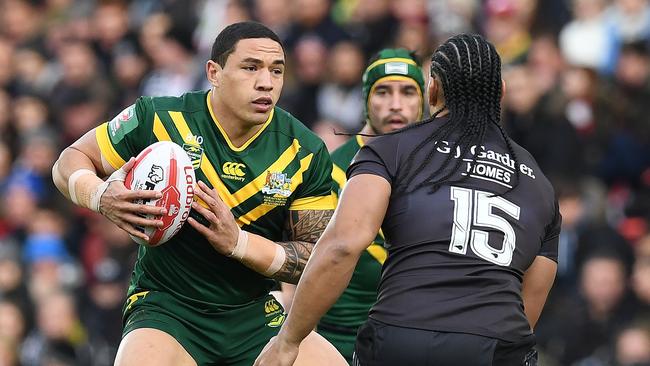 Australia's Tyson Frizell vies with New Zealand's Martin Taupau.