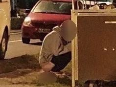 A man photographed defecating behind garbage bins at East Esplanade Park at Manly on the evening of Friday, September 24 when a large crowd of revellers were at the reserve in Manly Cove. Picture: Supplied