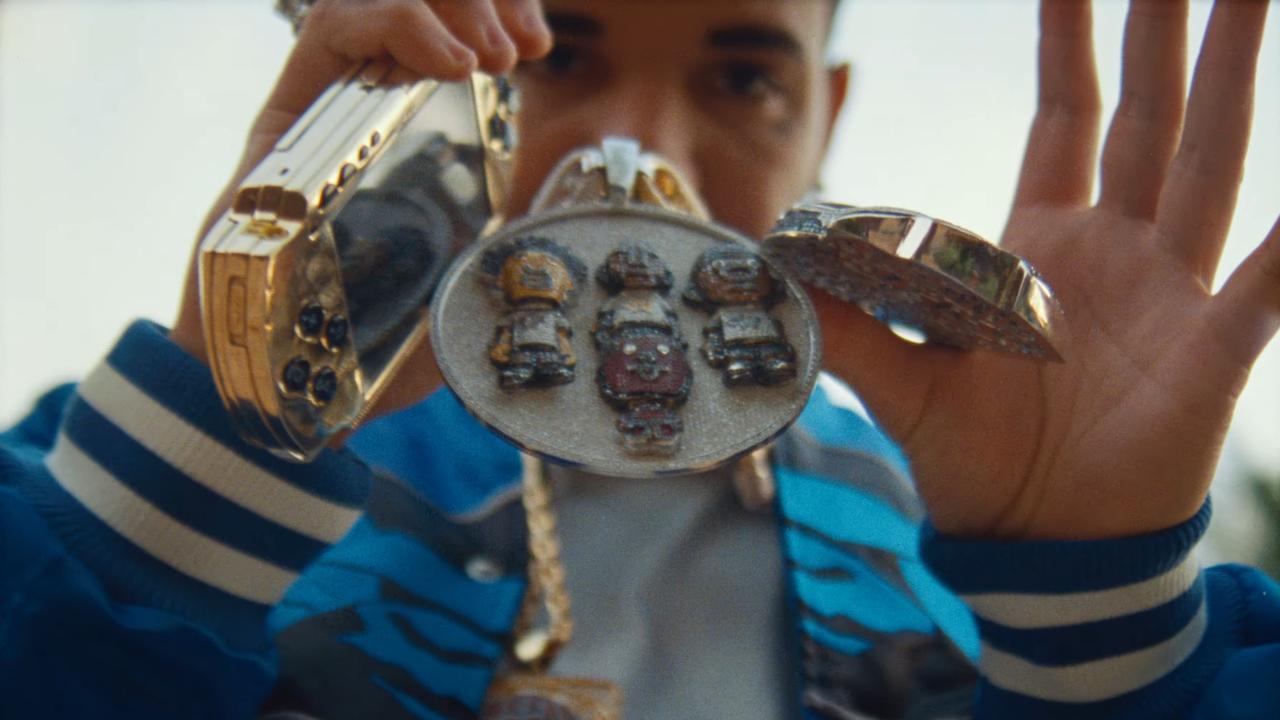 The gold PSP appears multiple times in Drake’s latest music video. Picture: YouTube