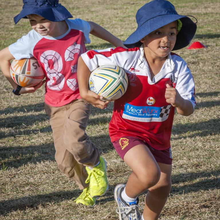 Taufa Taulani, right, as a young student at Mango Hill State School. Pictures by Russell Brown.