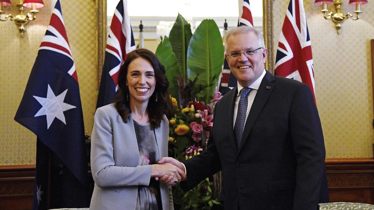 PM’s meet: Jacinda Ardern, left, poses with Scott Morrison for a formal photo as they meet. Picture: Bianca De Marchi/AP