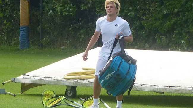 Akira Santillan destroys all five of his racquets after losing a Wimbledon qualifier. Picture: Ricky Dimon/Twitter