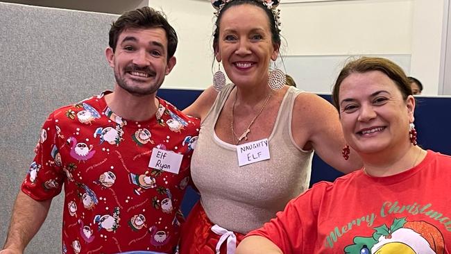 Councillor Ryan Bayldon-Lumsden with Amber Ford and Anita Oze, volunteering at the Labrador Community Centre Christmas Dinner.