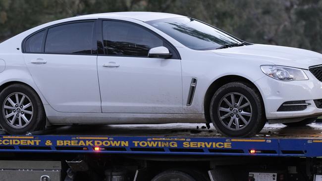 A police car at the crime scene in Barnawartha North. Picture: Simon Dallinger