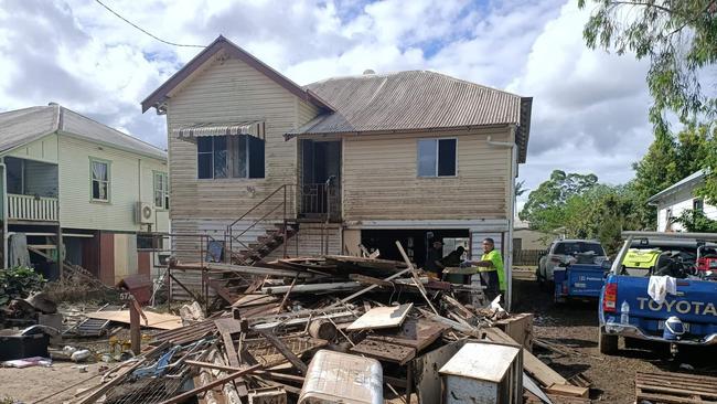 Just some of the rubbish outside Bill Walsh's Lismore home after the NSW flood. He was rescued after frantic triple-0 calls went unanswered. He was up to his neck in water when a local's tinnie arrived.