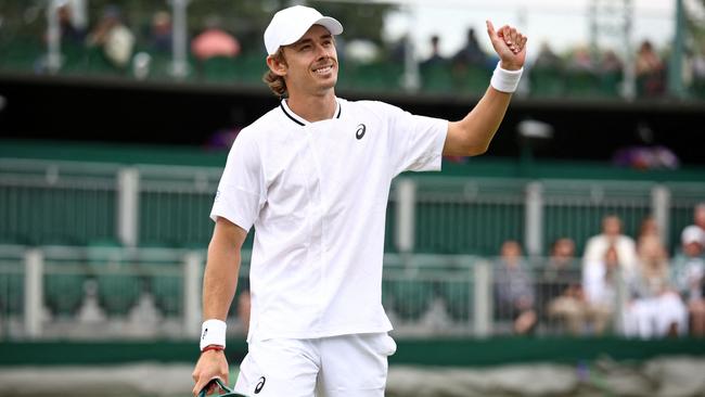 Australia's Alex De Minaur celebrates winning against Australia's James Duckworth during their men's singles tennis match on the second day of the 2024 Wimbledon Championships.